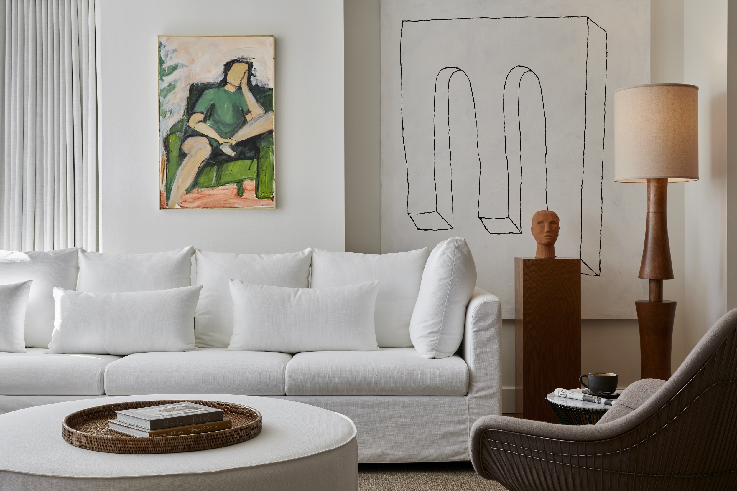 Plush white sofa and artwork in Lyle Suite.