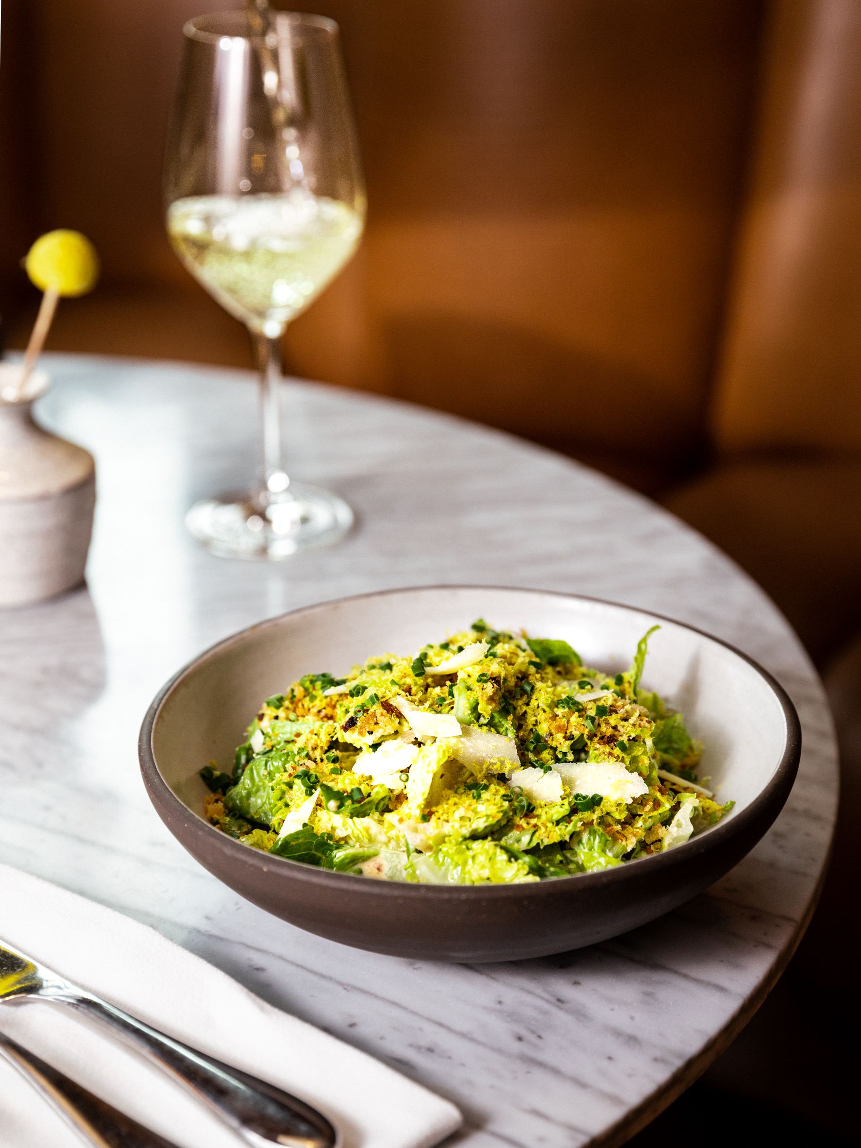 Plate of food with a glass of wine