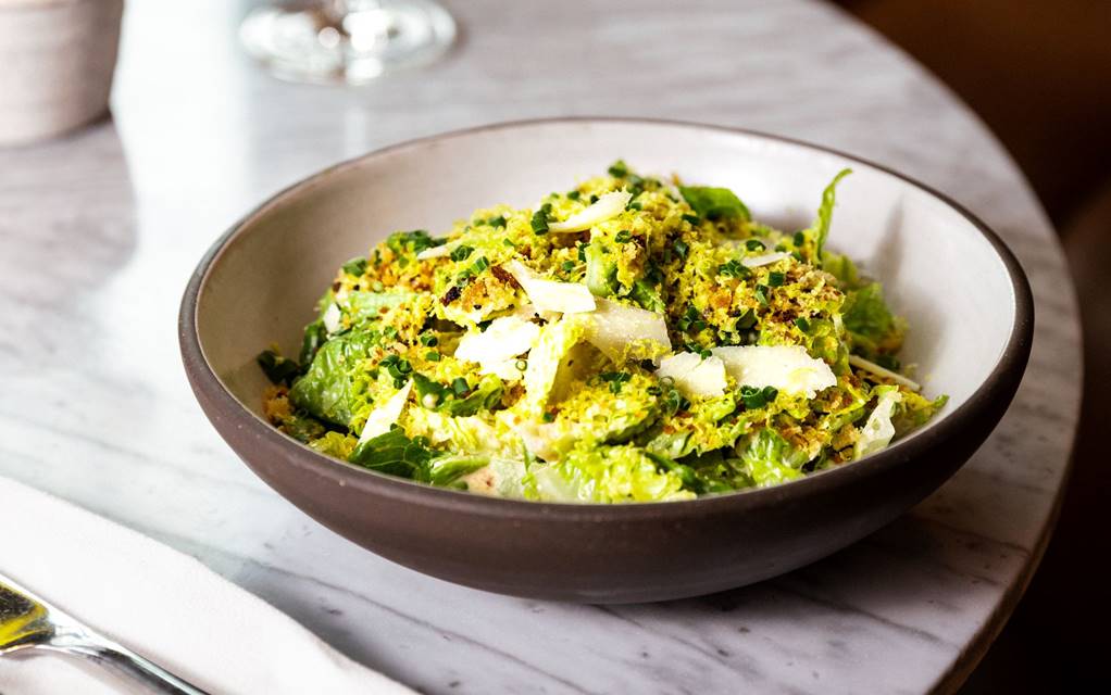 Plate of food with a glass of wine