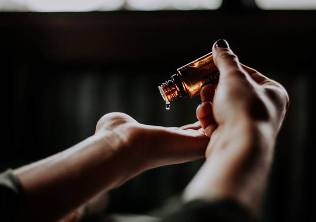 Hands displaying essential oils