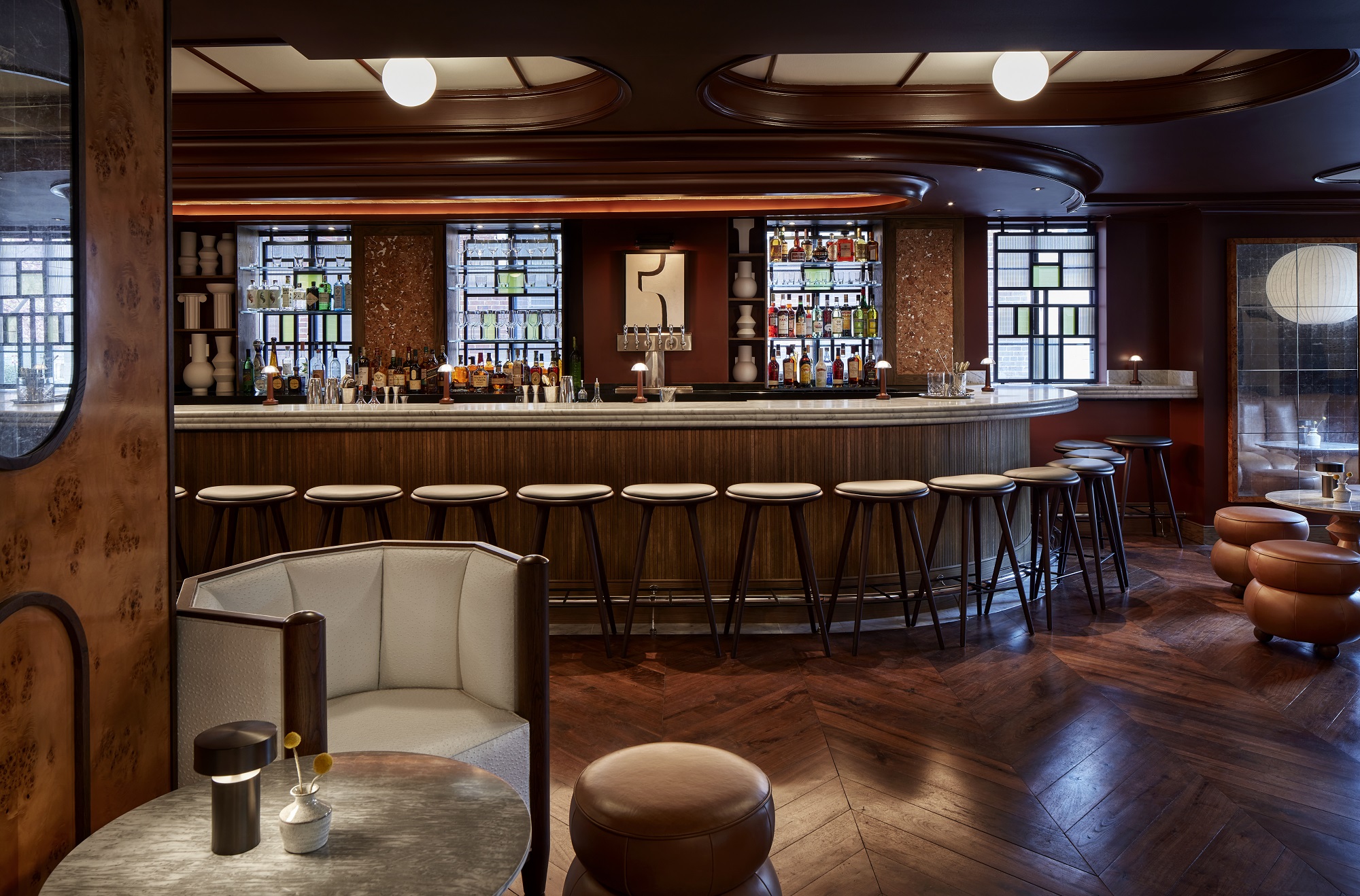 Barstools and soft lighting in the bar at Lyle's in DC.