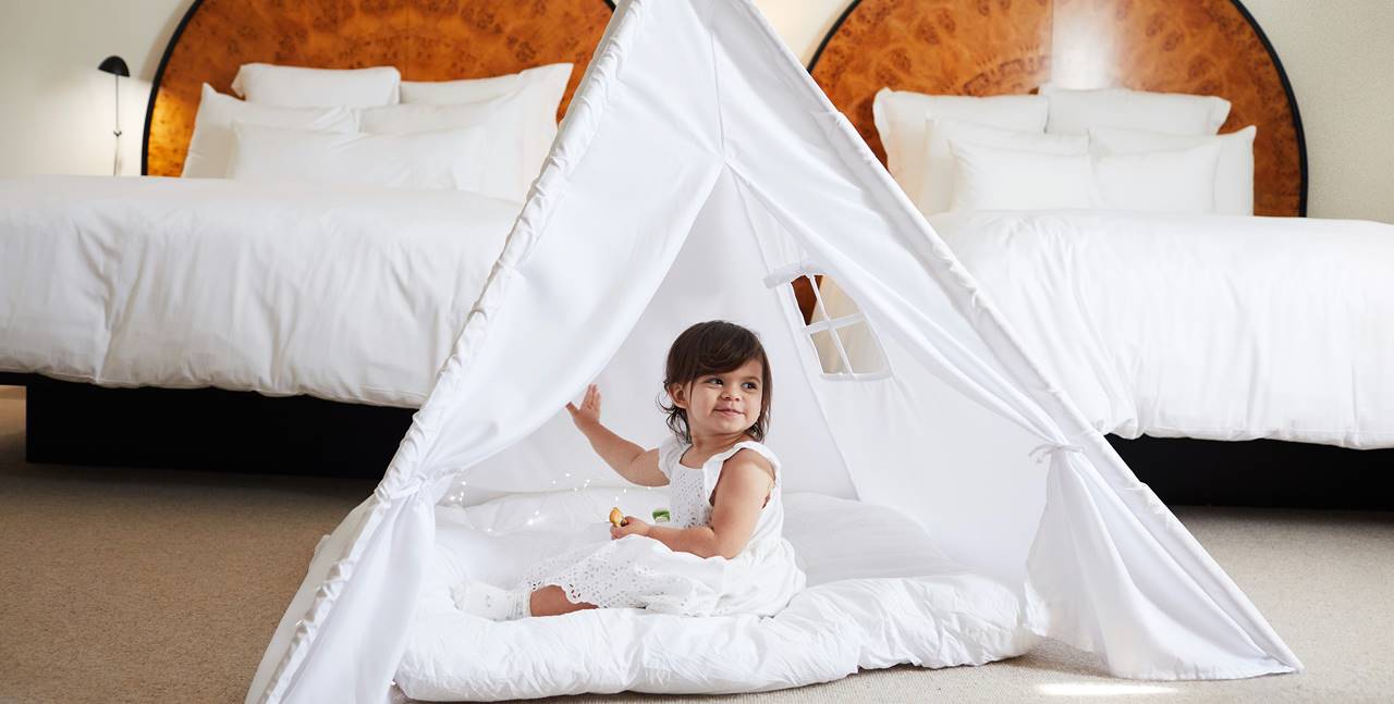 Young child with play tent
