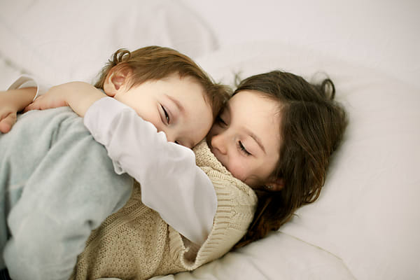 Two children hugging