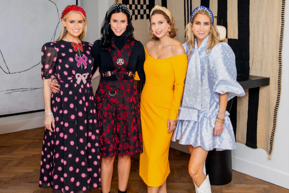 Four fashionable women in a row