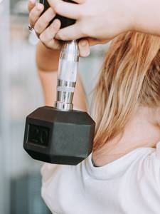 Close up of woman lifting a weight