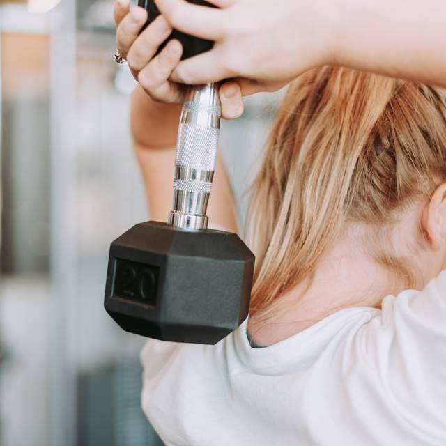Close up of woman weight lifting
