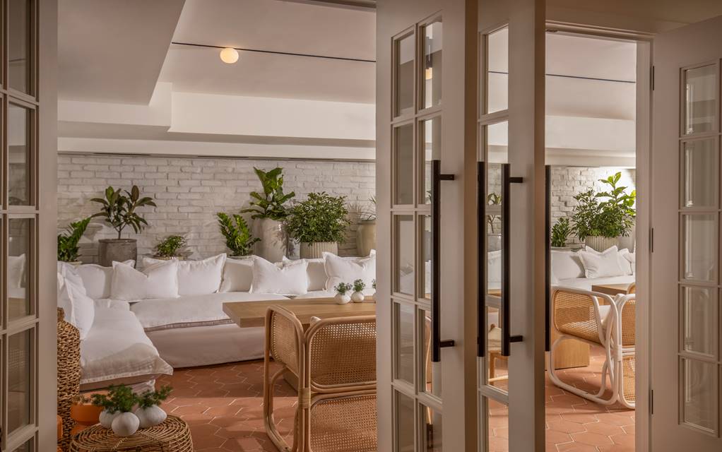 Glimpse of the white couches through the open Conservatory doors