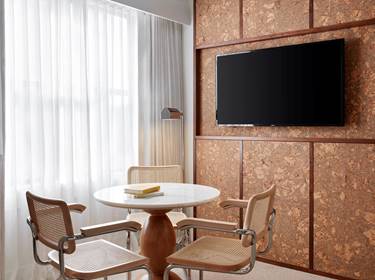 Table and chairs by window in Lyle guestroom
