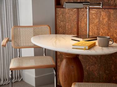 Detail of table, chairs and lamp at a hotel room at Lyle DC.