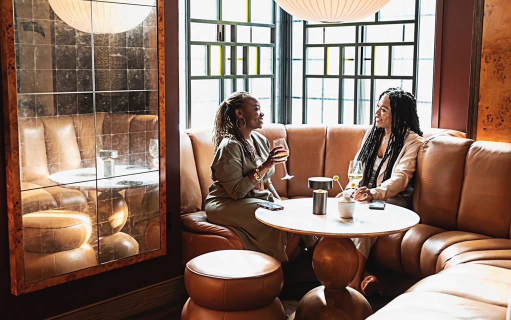 Two women drinking wine at Lyle's Restaurant and Bar