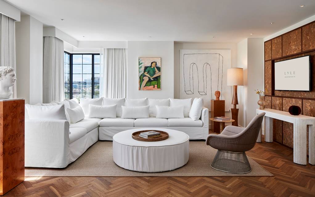 View of Lyle Suite living area with white sofa and coffee table