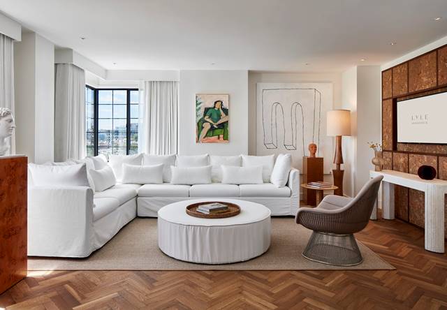 View of Lyle Suite living area with white sofa and coffee table