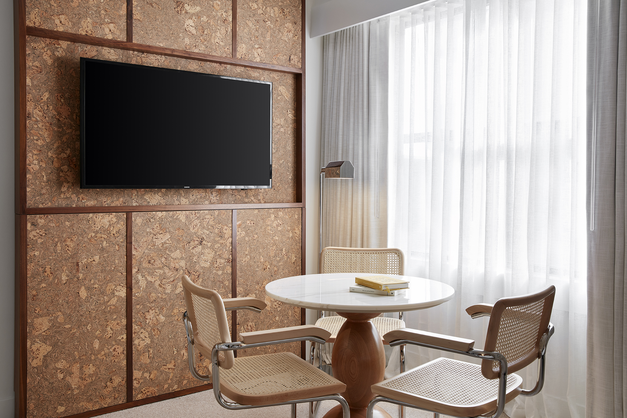 Room detail of table with chairs and tv