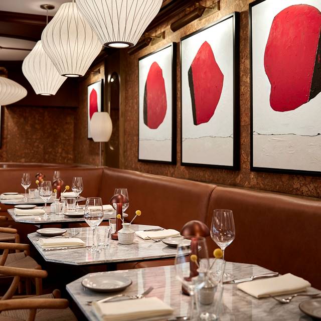 Detail of row of tables and chairs in Lyle's Restaurant and Bar
