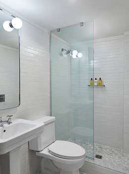 Toilet and shower inside bathroom